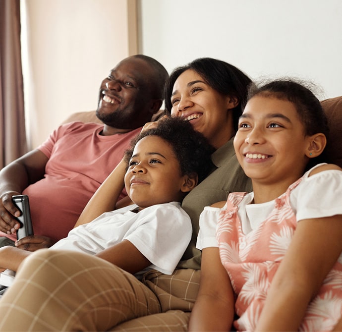 Happy family on new couch