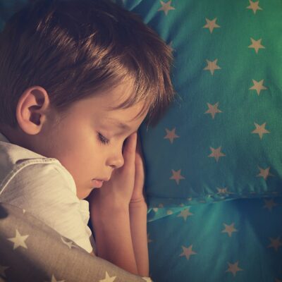 Child sleeping in new bed