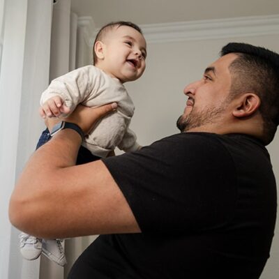Grateful father holding their child