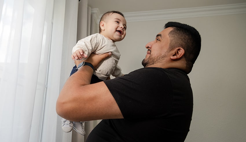 Grateful father holding their child