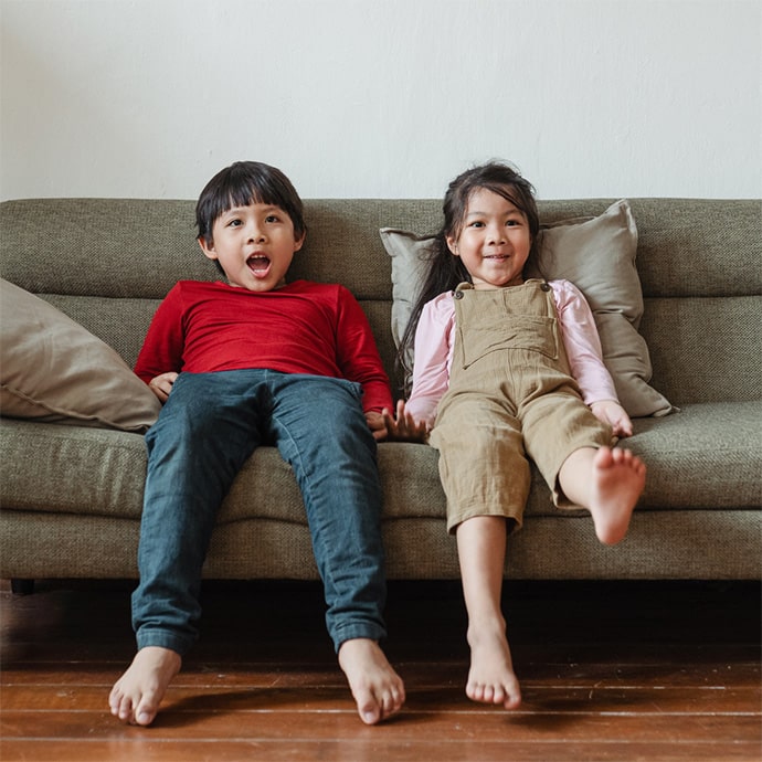 Happy children on new couch