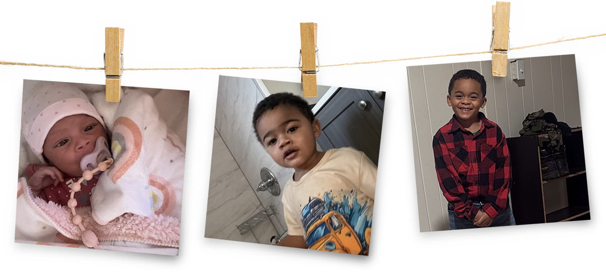 Clothes line with 3 photos of children pinned to it.