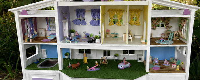 Entertainment center transformed into extravagant dollhouse